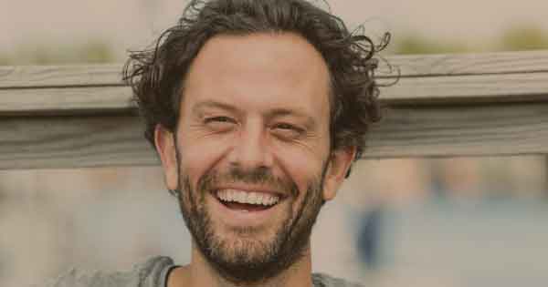 Confident husband smiling after rebuilding his confidence