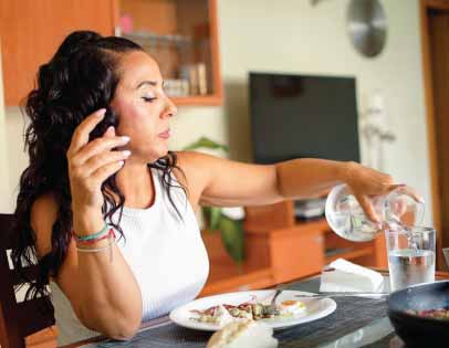 Wife sitting at the kitchen table before telling her husband she wants separation